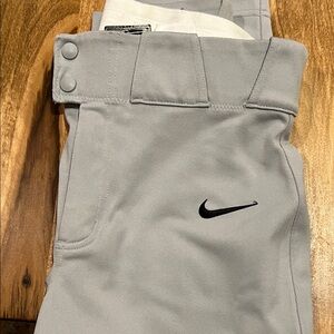 Nike Grey Baseball pant.Men’s Small- Black Nike swoosh. 
Never worn- no tags.